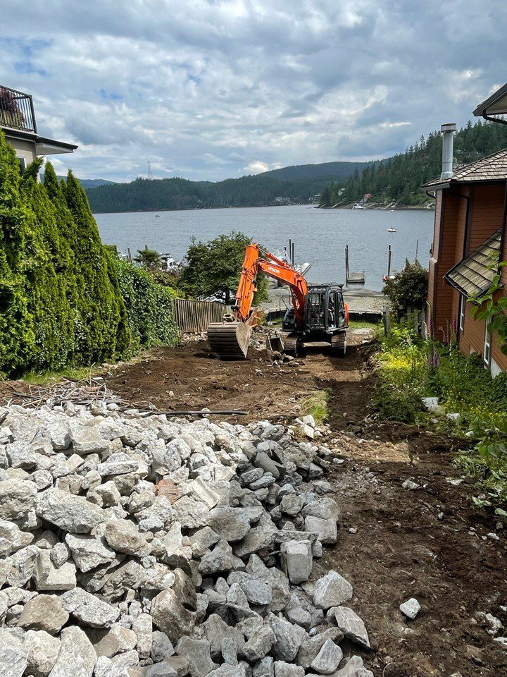 Site preparation (an often unexpected cost when building a house) for a custom home build on water