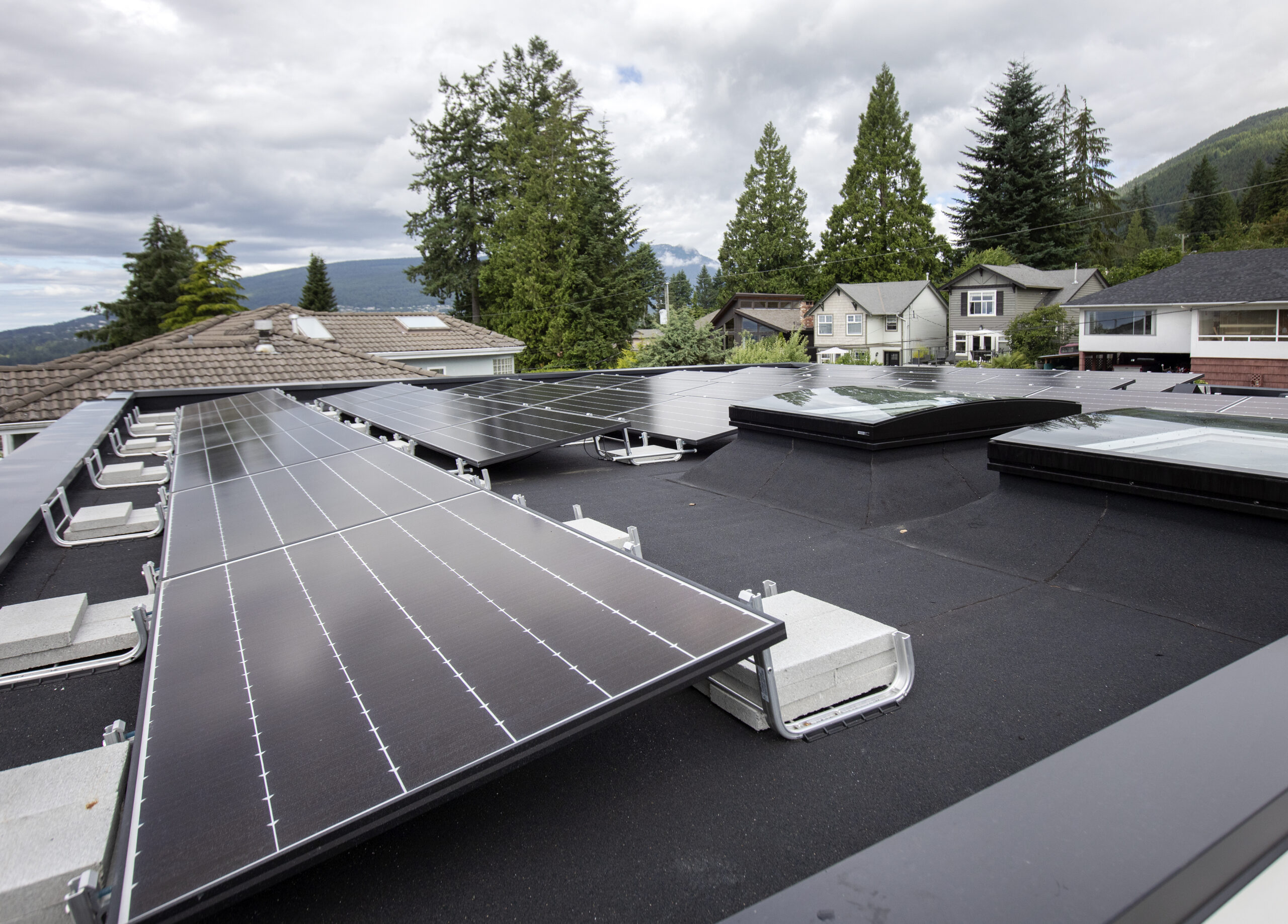 Rooftop solar panels at Linda Vista custom Net Zero home built by Hasler Homes
