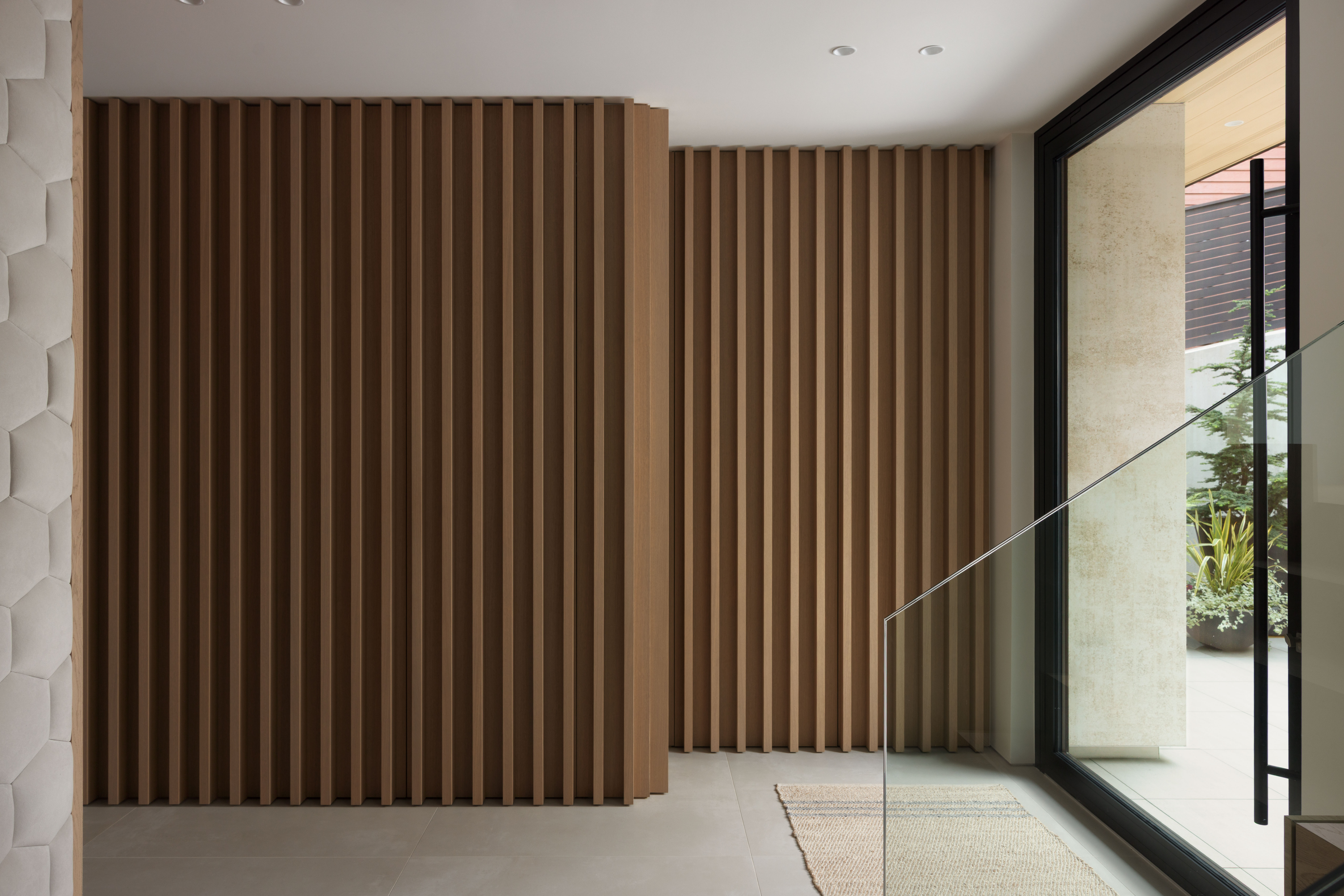 Fala custom home interior with custom millwork wall and hidden office door