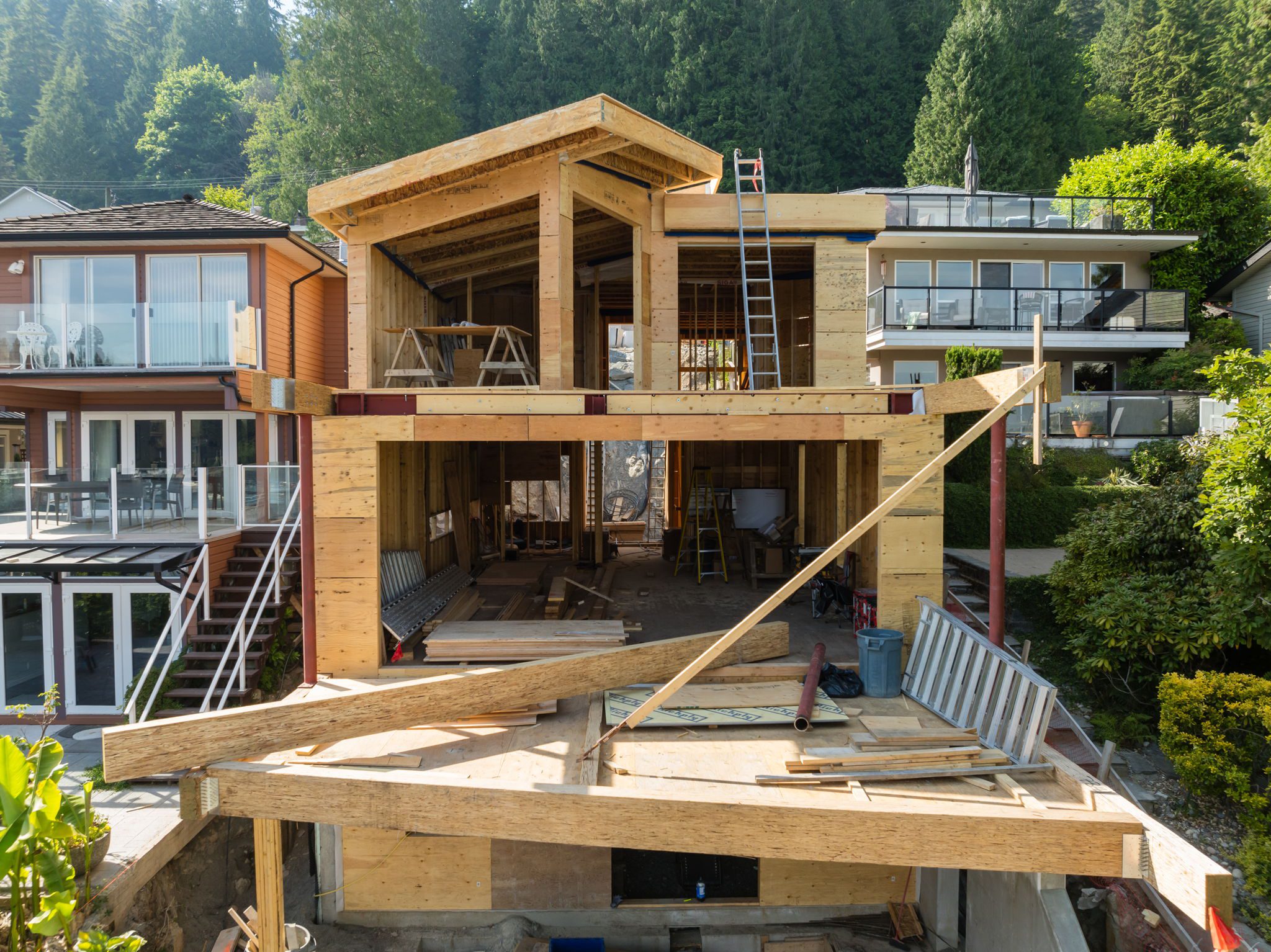 Rear view of the Fala custom home under construction on a sloped lot in North Vancouver.